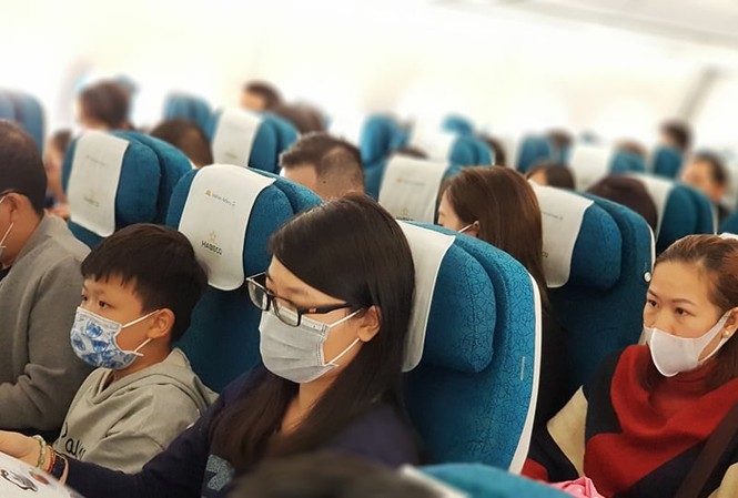 Không đeo khẩu trang trên máy bay bị phạt tới 3 triệu đồng Không đeo khẩu trang trên máy bay bị phạt tới 3 triệu đồng